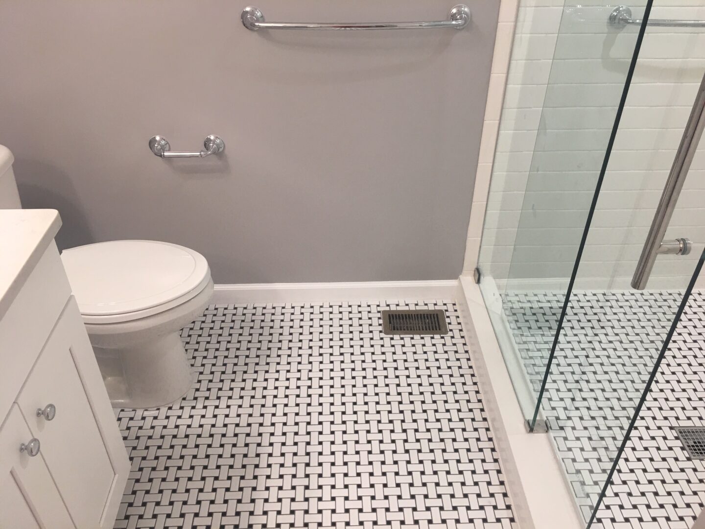 A bathroom with a toilet and shower in it