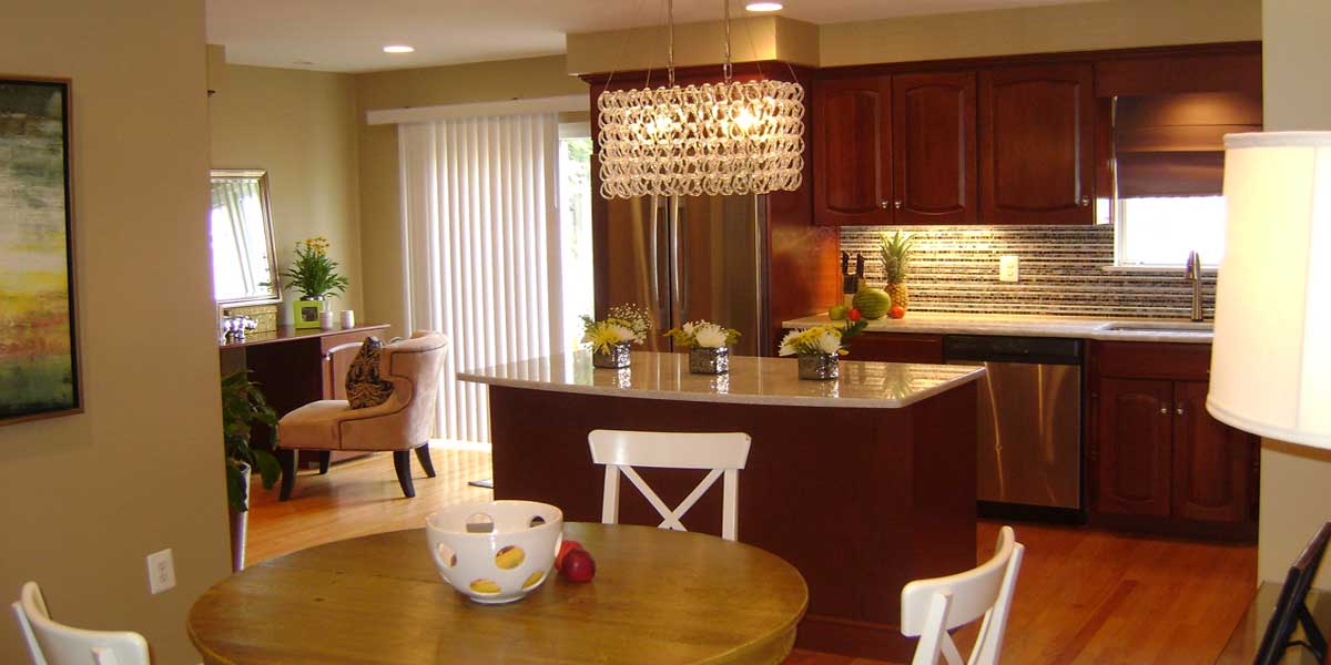 A kitchen with a dining table and chairs